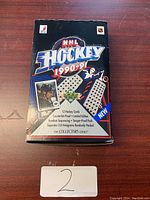 Closed NHL Hockey 1990-91 collector card box showing branding and features of the pack