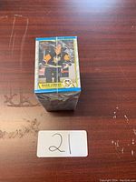 Photo showing front of shrink-wrapped hockey card stack featuring Mario Lemieux in Penguins jersey