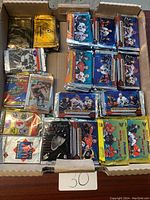 Box of assorted sealed hockey card packs