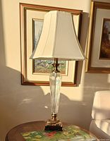 Photo showing first off-white shade table lamp with ribbed glass and metal base, approx 31" tall