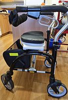 Front view showing walker with seat, basket and wheels