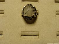 Top view of the silver ring showcasing the large cushion-cut tourmalinated quartz gemstone with visible black needle-like inclusions.