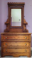 Front view of oak dresser with attached mirror