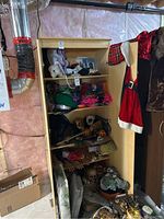 Full view of the wood-look storage cabinet with the door open, showing one fixed shelf and three adjustable shelves inside. Various items stored on shelves but not included.