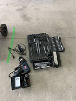 Overview of all tools including power tools and hand tools laid on floor surface