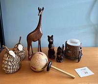 Full view of the lot showing all wooden collectibles and the candle holder