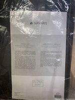 Photo of Navaris brand packaging label on black heavy duty landscape barrier fabric membrane, showing product specs and instructions.