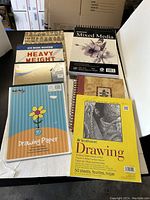 Lot items overview showing variety of drawing pads and journal covering multiple brands and paper types.