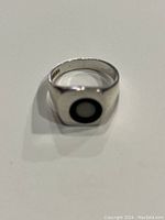 Front view of sterling silver ring with black lapis inlay and fire opal in center, square face, size 10 1/4