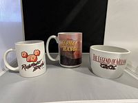 Front view of three Disney mugs: Runaway Brain, Home on the Range, and The Legend of Mulan.