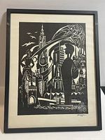 Framed modernist black and white art print visible in full showing details of design and signature dated 1977.