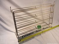 Front view of Ceramco Vacuum Porcelain metal display rack with measuring tape showing width of about 20 inches.