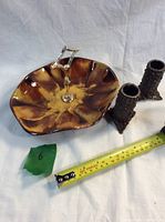 Photo of candy dish with silver-tone handle and two textured metal candle holders next to a measuring tape for scale.