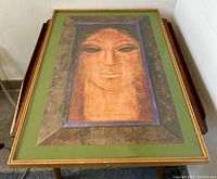 Frontal view of the framed Romanian Art Deco modernist painting depicting a stylized face by Eugenia Dumitrascu.