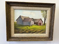 Frontal view of the framed oil painting showing the barn landscape and tree.