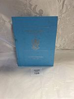 Blue hardcover alumni directory book for Phi Delta Theta Fraternity with gold embossed text and crest on the front cover.