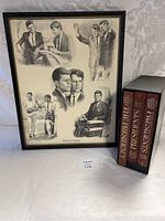 Framed artwork showing Kennedy brothers in multiple scenes and the three hardcover books in slipcase on a white cloth background.