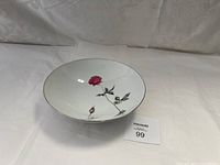 Large white ceramic bowl with detailed red rose and bud design inside, photo taken to show the floral pattern and overall condition.