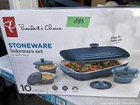 Front of the box showing 10-piece stoneware bakeware set with glazed finish and oven-to-table use