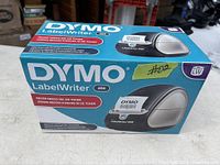 Box of Dymo LabelWriter 450 label printer showing branding, model, and packaging in good condition.