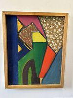 Front view of the abstract modernist oil painting on board with wooden frame, showing vibrant geometric shapes and patterns.