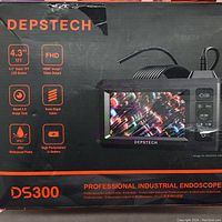 Box of the DEPSTECH DS300 professional industrial endoscope showing key features like 4.3 inch TFT screen, FHD 1080p output, dual camera with LED light, semi-rigid cable, IP67 waterproof probe, high-performance Li-ion battery.