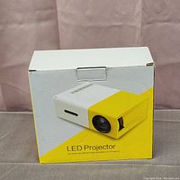 Box of LED projector showing image and labeling