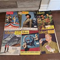 Six Liberty magazines from the 1940s arranged showing front covers with wartime themes and various cover illustrations and photos.