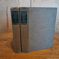 Two hardcover books from the Classics Edition De Luxe series standing upright showing spines: Greek Volume One Epic Literature and Latin Volume Two Virgil.