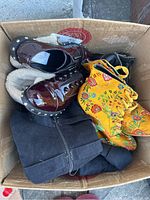 Box containing all six pairs of shoes showing variety and condition