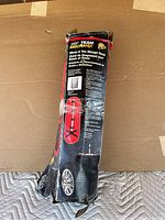 Photo of original product packaging box showing brand, product name, and image of assembled wheel and tire storage stand.