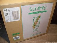 Box of Infinity US1 Universal Satellite speakers showing branding and model details.