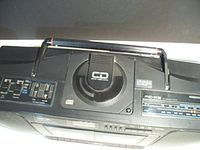 Top view showing CD player with logo and control panel