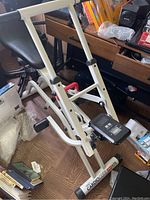 Left side view of the Wellso Cardioglide Plus 975 featuring metal frame, seat, pedals, and LED display panel.