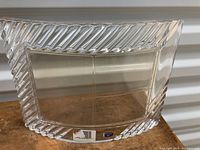 Close-up of the front of the clear Bohemian crystal photo display frame showing the diagonal striped textured edges and the empty photo slots.