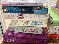 Stack of 7 books including Marian Keyes titles and other authors