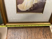 Photo showing width measurement of the framed print approximately 12 inches wide.