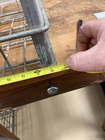 Photo showing measurement approximately 13 inches for length of the metal crate.