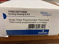 Box label showing model number 1F80C0471HDG and branding by Harding Heating & A/C, Emerson Climate Technologies, Rodgers.