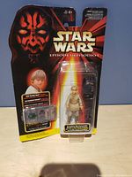 Front view of the packaged Anakin Skywalker action figure from Star Wars Episode I with Darth Maul artwork and logo