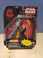 Front view of Star Wars Episode I Darth Maul figure with spinner in original packaging.