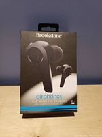 Front view of Brookstone Airphones true wireless earbuds box showing earbuds image and features.