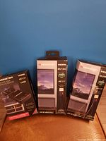 Three boxed Monster HDMI cables and one boxed Monster 4-device HDMI switch with remote, all showing 4K HDR UHD support on packaging