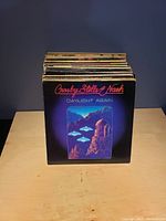 Stack of vinyl records showing 'Daylight Again' album by Crosby, Stills & Nash on front