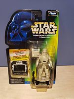 Front of Kenner Star Wars Snowtrooper action figure in blister card package featuring Darth Vader illustration and logo.