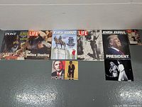 Overview photo showing all magazines and posters in the lot