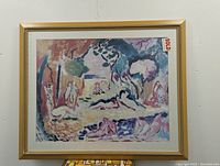 Photo of the framed lithograph artwork showing the full piece and frame with a sold label visible.