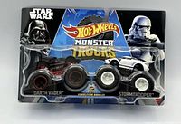 Front view of sealed Hot Wheels Monster Trucks package featuring Darth Vader and Stormtrooper Star Wars trucks.