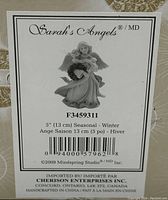 Back label of the box showing product details including size, brand, and year (2009 Mindspring Studio Seasonal - Winter).