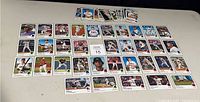 Top view of the 52 2022 Topps Heritage Baseball Rookie Cards spread on a flat surface showing multiple rows of cards.